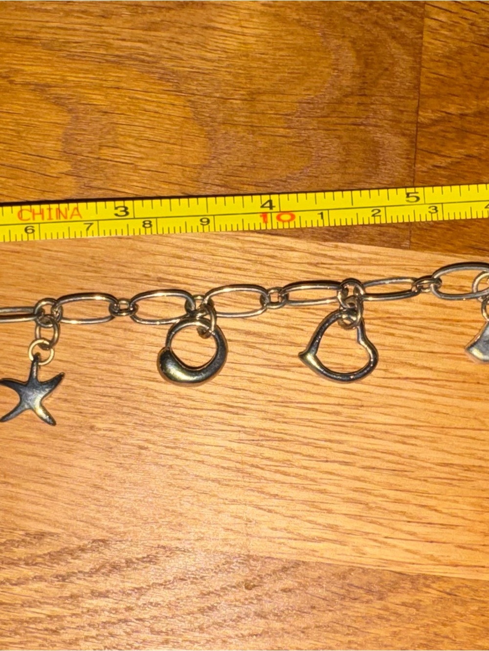Silver charm toggle clasp bracelet in size 7